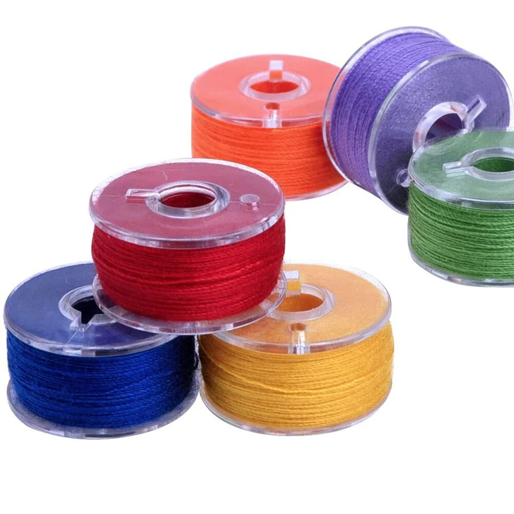 PREWOUND BOBBINS WITH POLYESTER SPUN THREAD